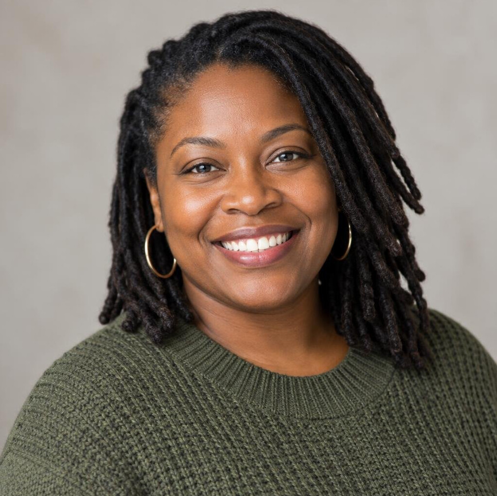 Black woman community organizer portrait smiling