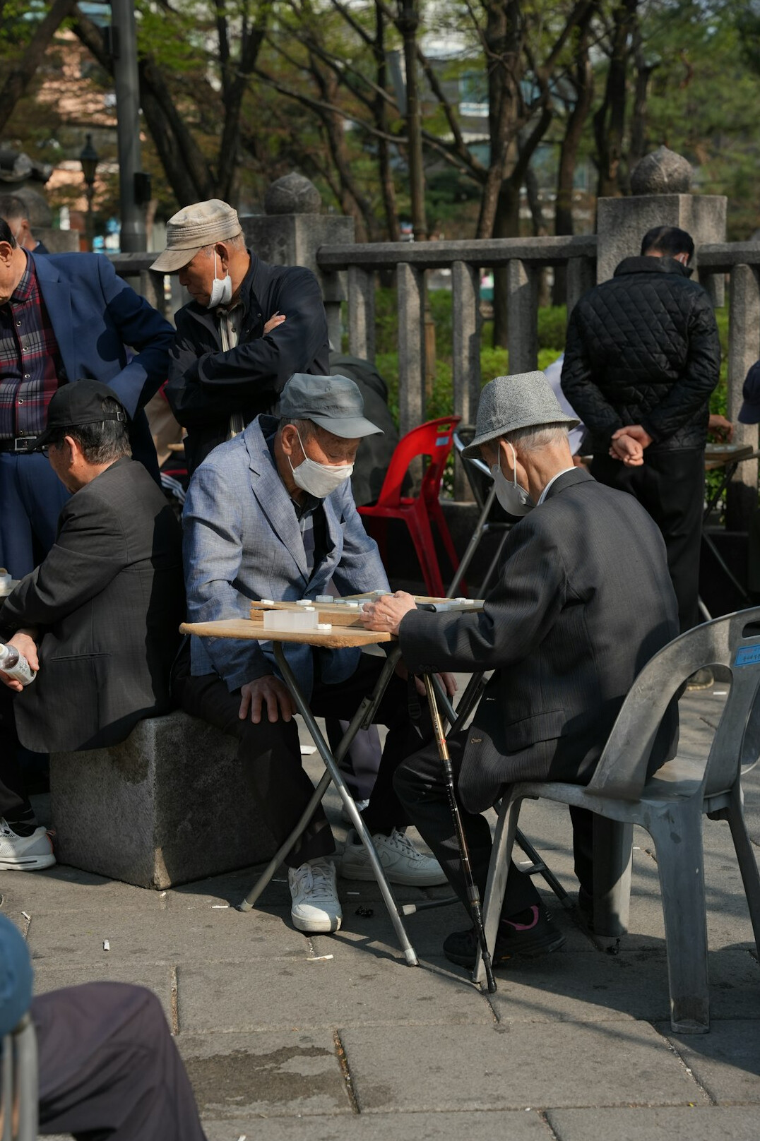 seniors playing cards outdoors